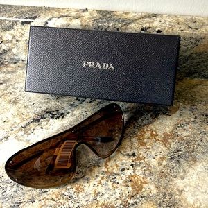 Prada sunglasses for women. New with tags and cases.